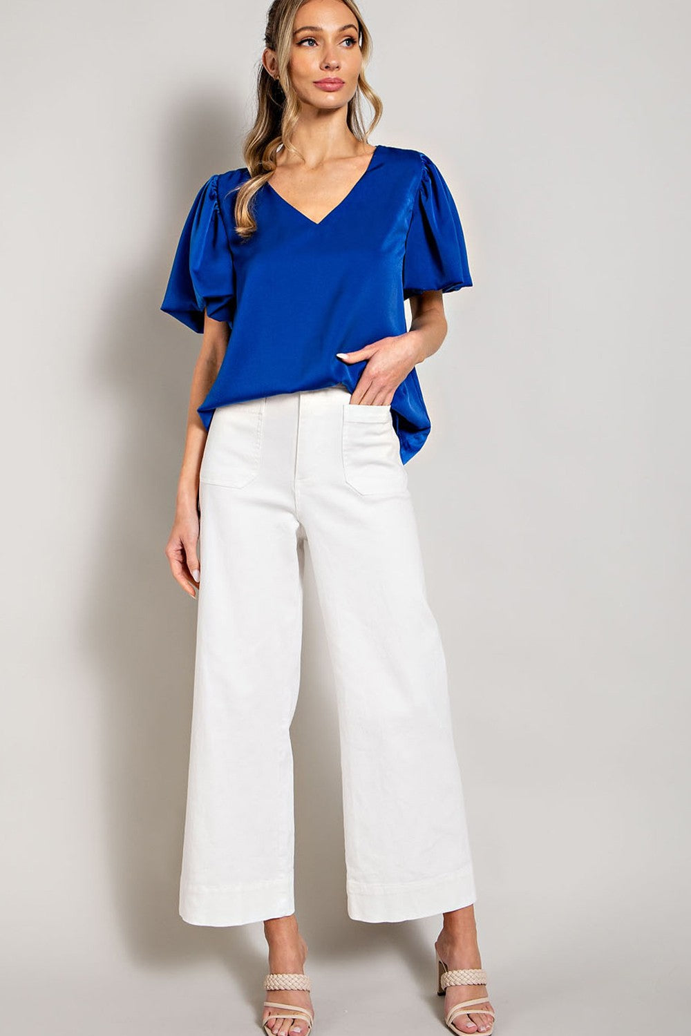 V-neck blouse top featuring short puff sleeves