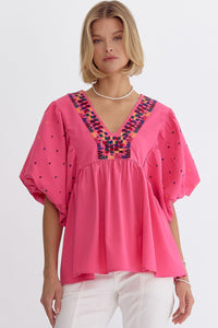 Solid v-neck short sleeve top with embroidered detail