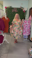 Load and play video in Gallery viewer, abstract V-neck midi dress
