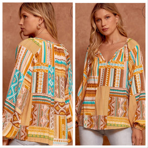 Printed top with split neckline and long sleeves